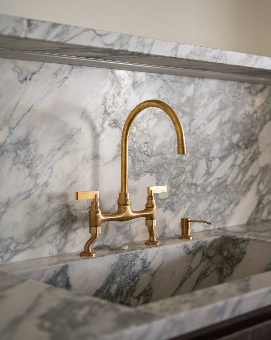 A Kitchen Bridge Mixer and Soap Dispenser