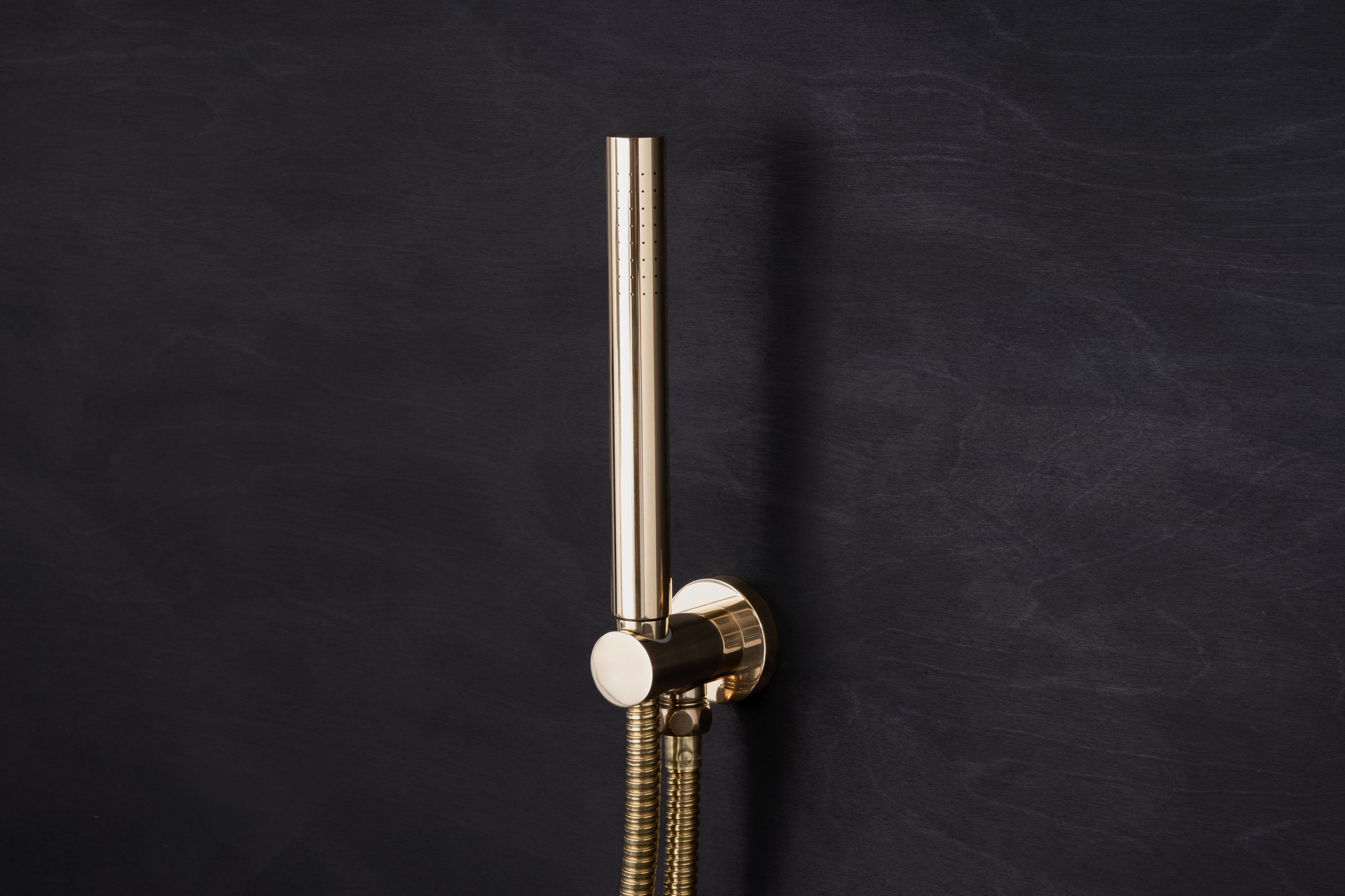 Wall Mounted Cylindrical Hand Shower with Combined Outlet & Mount by Studio Ore