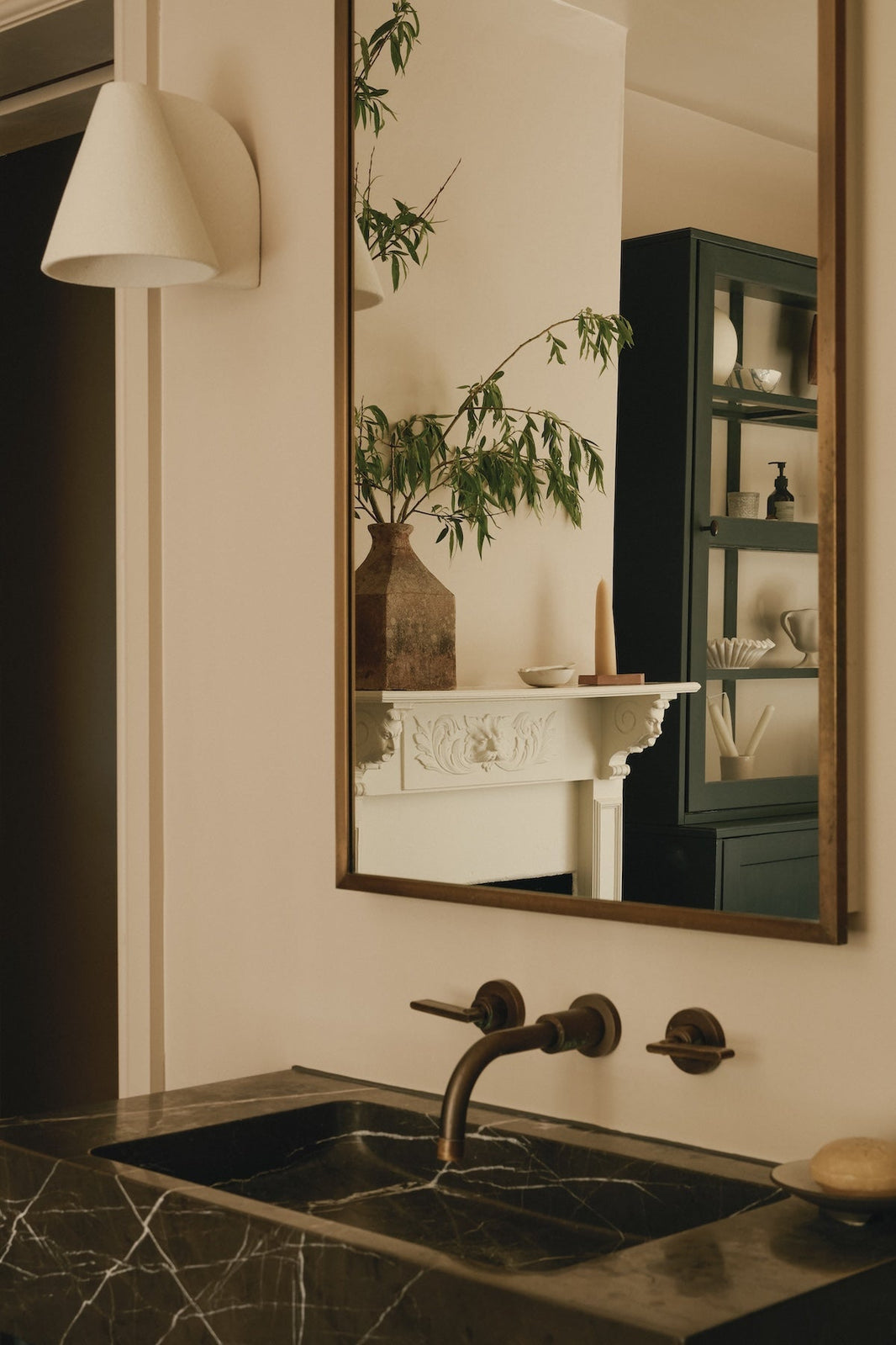 Studio Ore's three hole wall-mounted basin tap in unlacquered bronze.