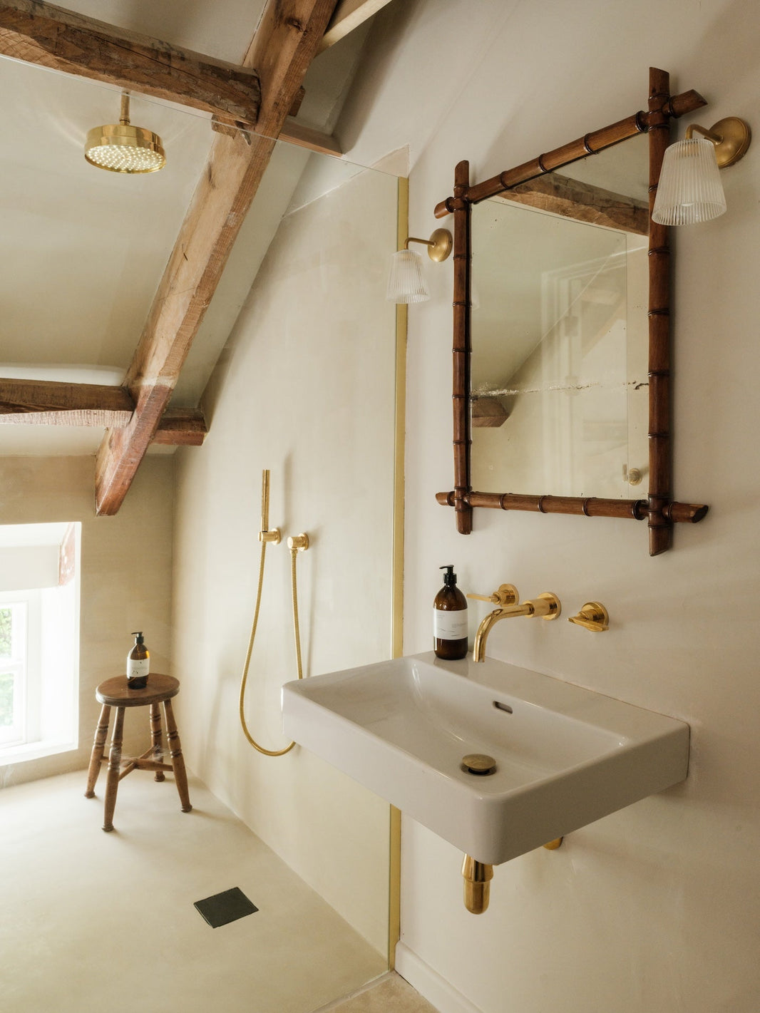 Ensuite bathroom of a room at Osip, featuring Studio Ore's solid brass tapware and shower. 