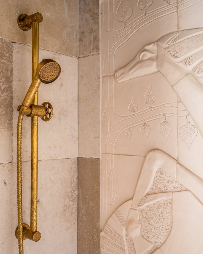 Shower on Riser by Studio ORE in living brass