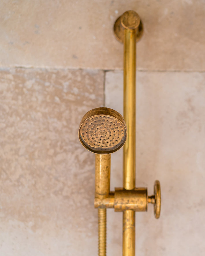 Shower on riser with patina 