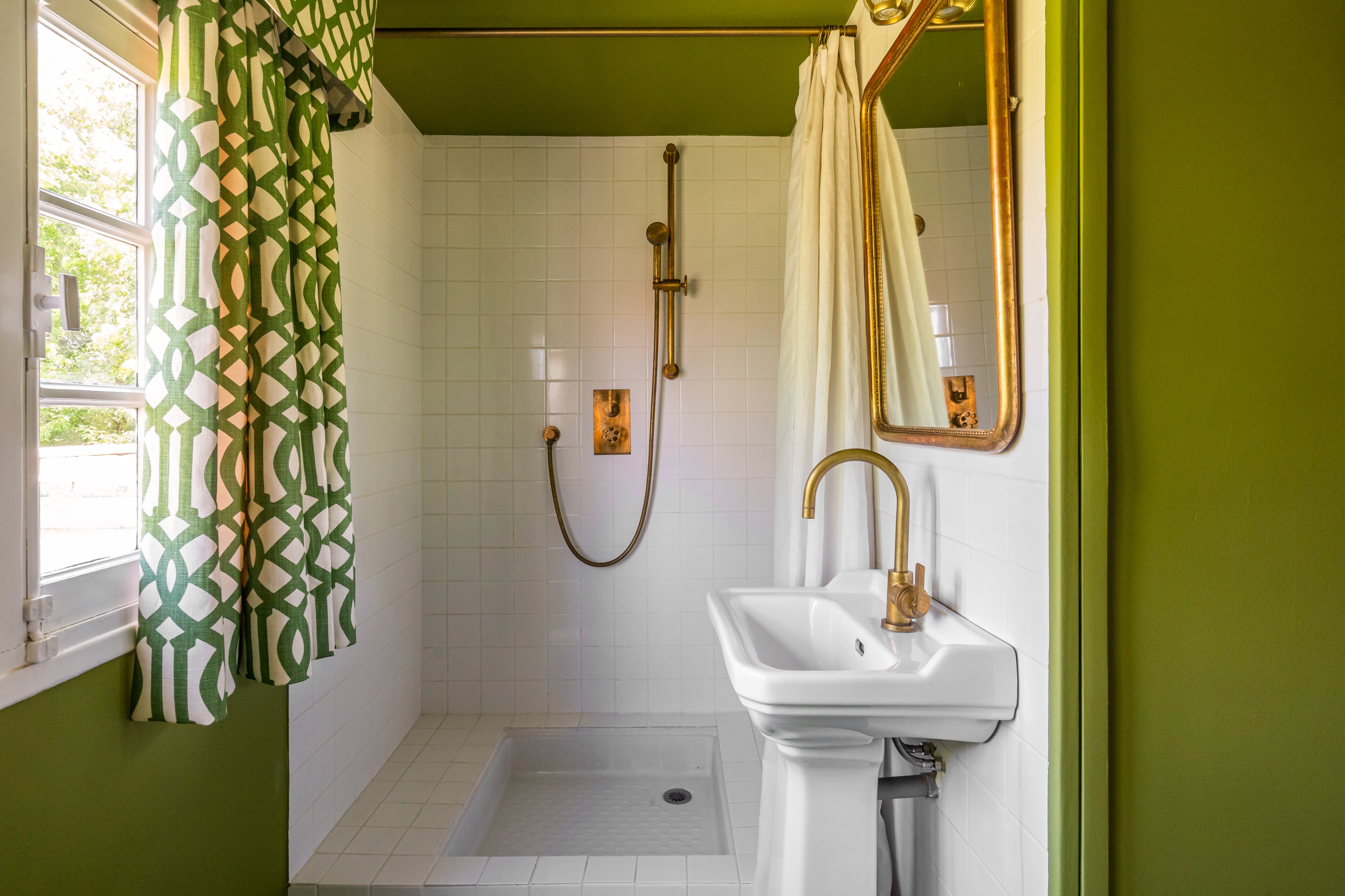 Guest bathroom featuring Studio ORE unlacquered brass fittings