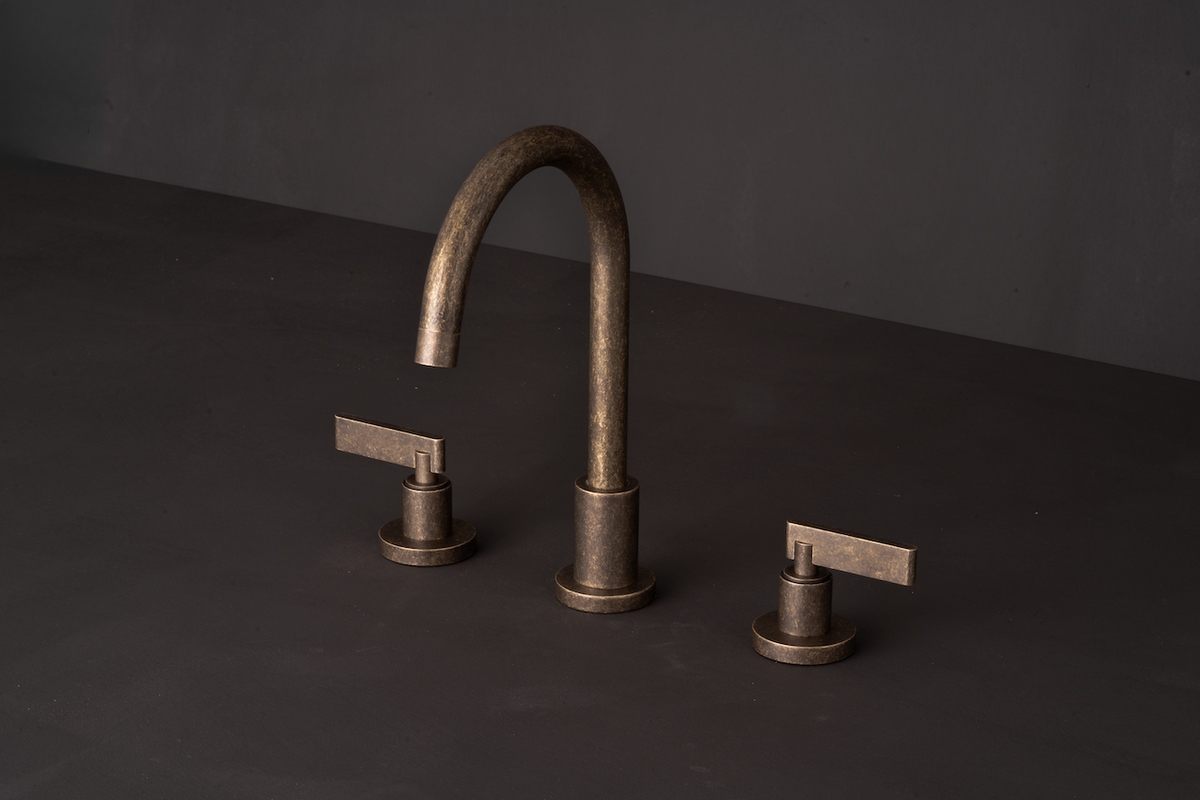 Studio Ore's Three Hole Deck Mounted Basin Tap from Chapter One in unlacquered polished brass. 