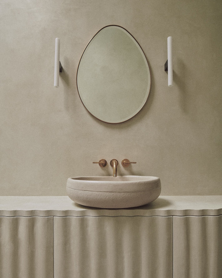 Studio Ore's wall-mounted basin tap from Chapter One in a minimal bathroom.