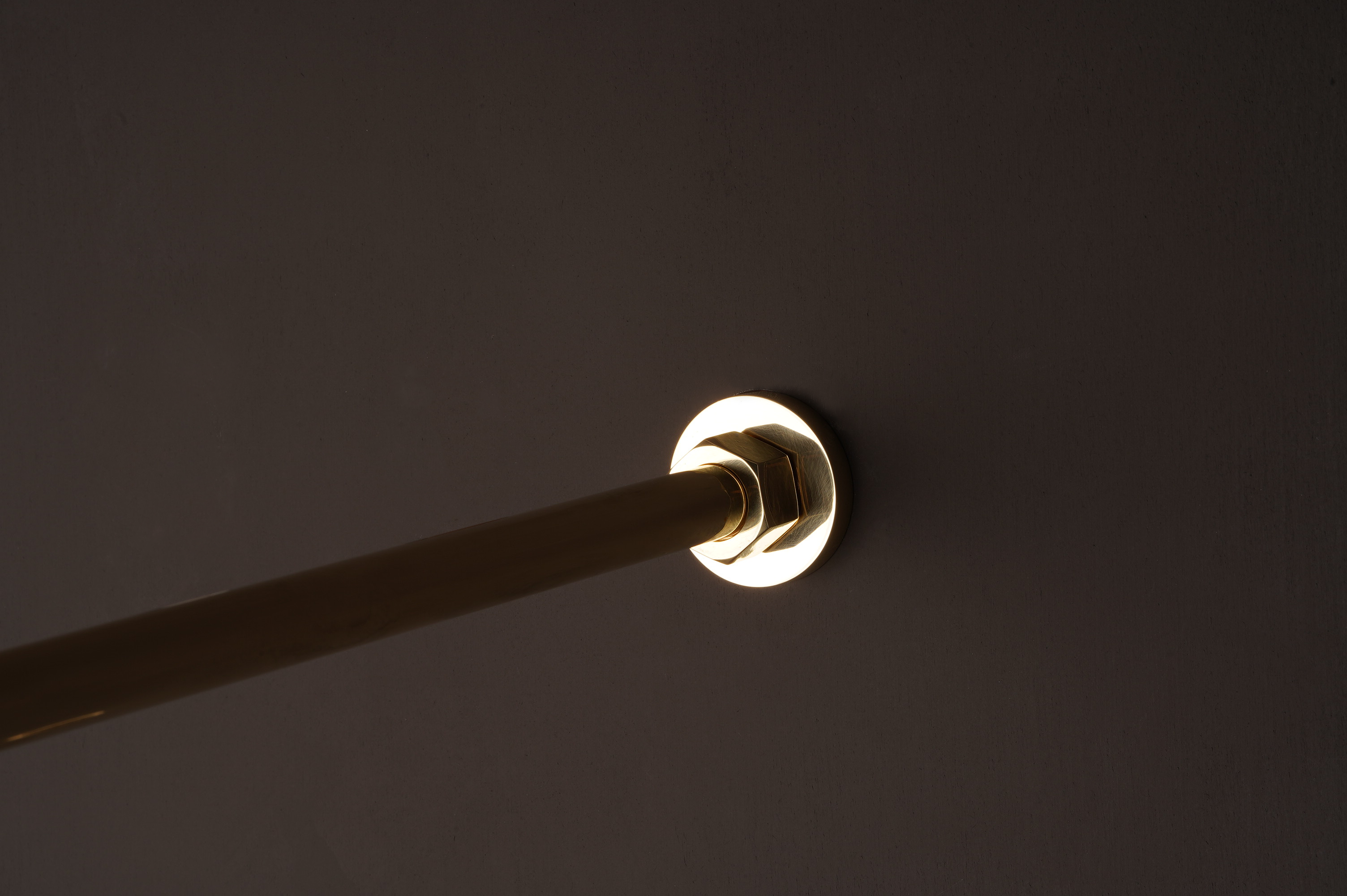 brass shower arm close up