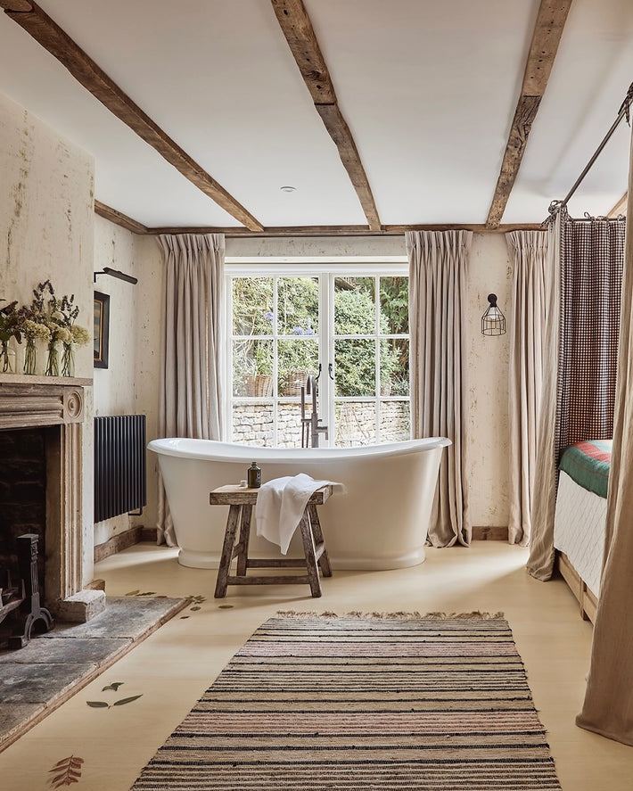 Studio Ore's floor mounted basin mixer tap has a modern look. Here it stands over a roll top bath in a period property. Contrasting with the traditional features.