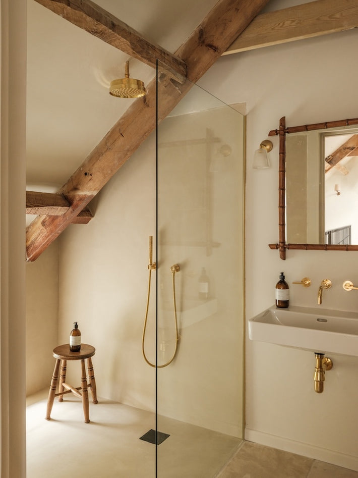 Ensuite bathroom at Osip featuring Studio Ore's solid brass tapware and shower. 