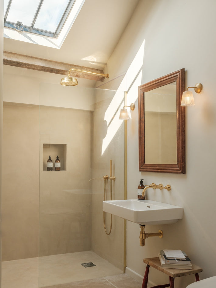 Ensuite bathroom at Osip, featuring Studio Ore's solid brass tapware and showers. 
