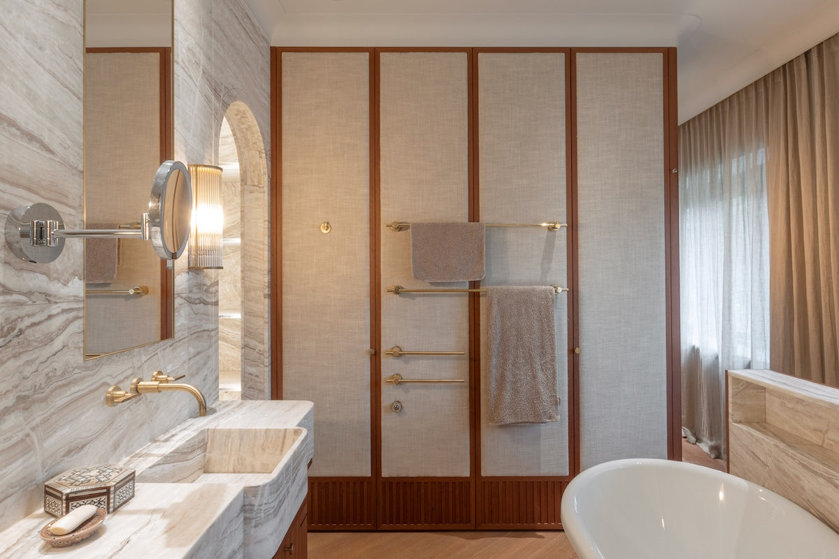 Studio Ore's fittings inside a modern bathroom. All in unlacquered brushed brass. 