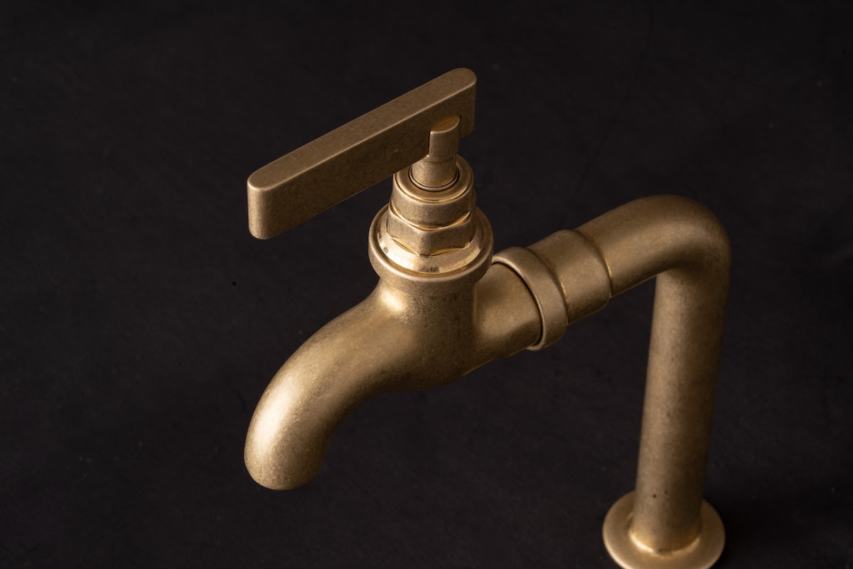 Studio Ore's Single Deck Mounted Bib Tap from Chapter Two in Tumbled Brass.