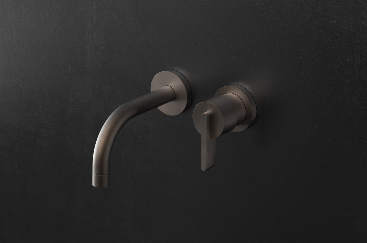 Studio Ore Chapter Three Two Hole Wall Mounted Basin Mixer with Curved Spout with Lever handle in bronze