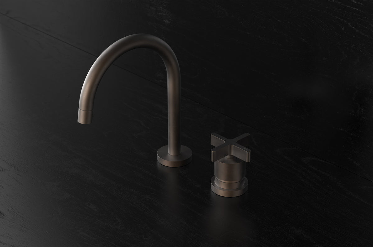 Studio Ore Chapter Three Two Hole Deck Mounted Basin Mixer with Curved Spout with Cross handle in bronze
