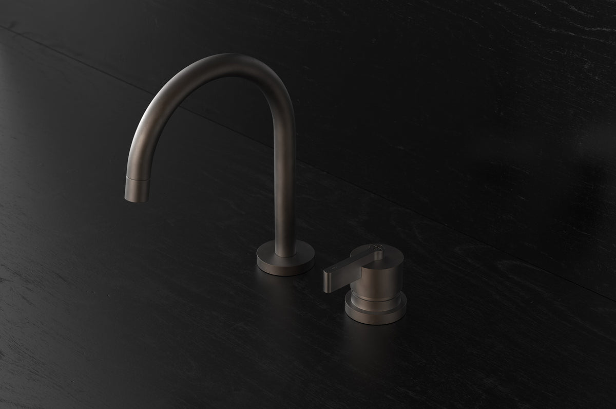 Studio Ore Chapter Three Two Hole Deck Mounted Basin Mixer with Curved Spout with Teardrop Lever handle in bronze