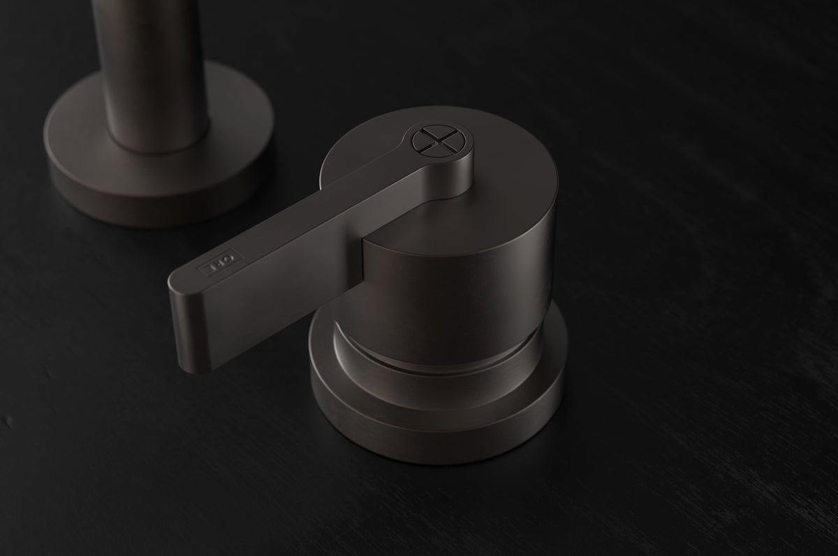 Studio Ore Chapter Three Deck Mounted Basin Two Hole Mixer with Teardrop Lever handle in bronze, detail view