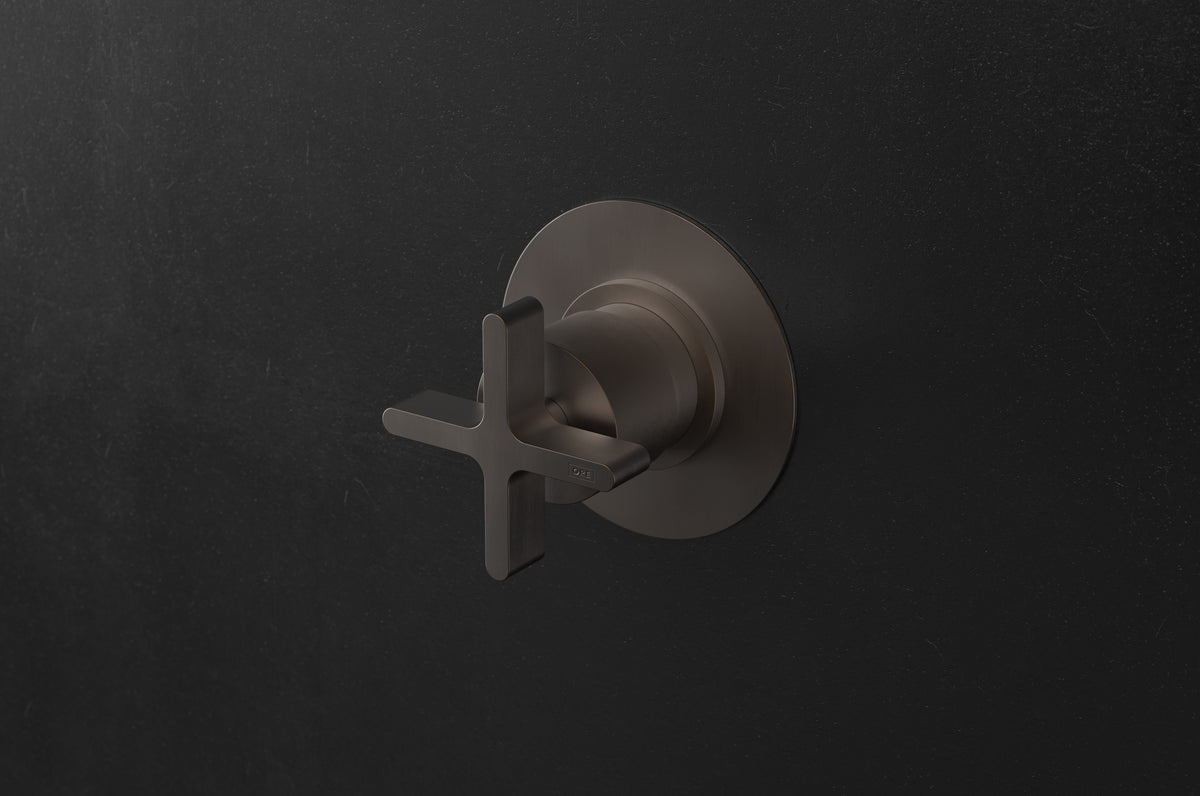 Studio Ore Chapter Three Wall Mounted Shower Mixer with Cross Handle in bronze, circular backplate