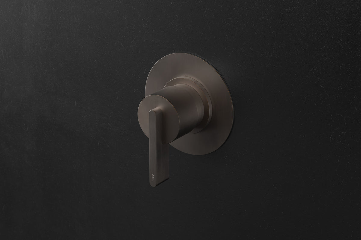 Studio Ore Chapter Three Wall Mounted Shower Mixer with Lever Handle in bronze, circular backplate