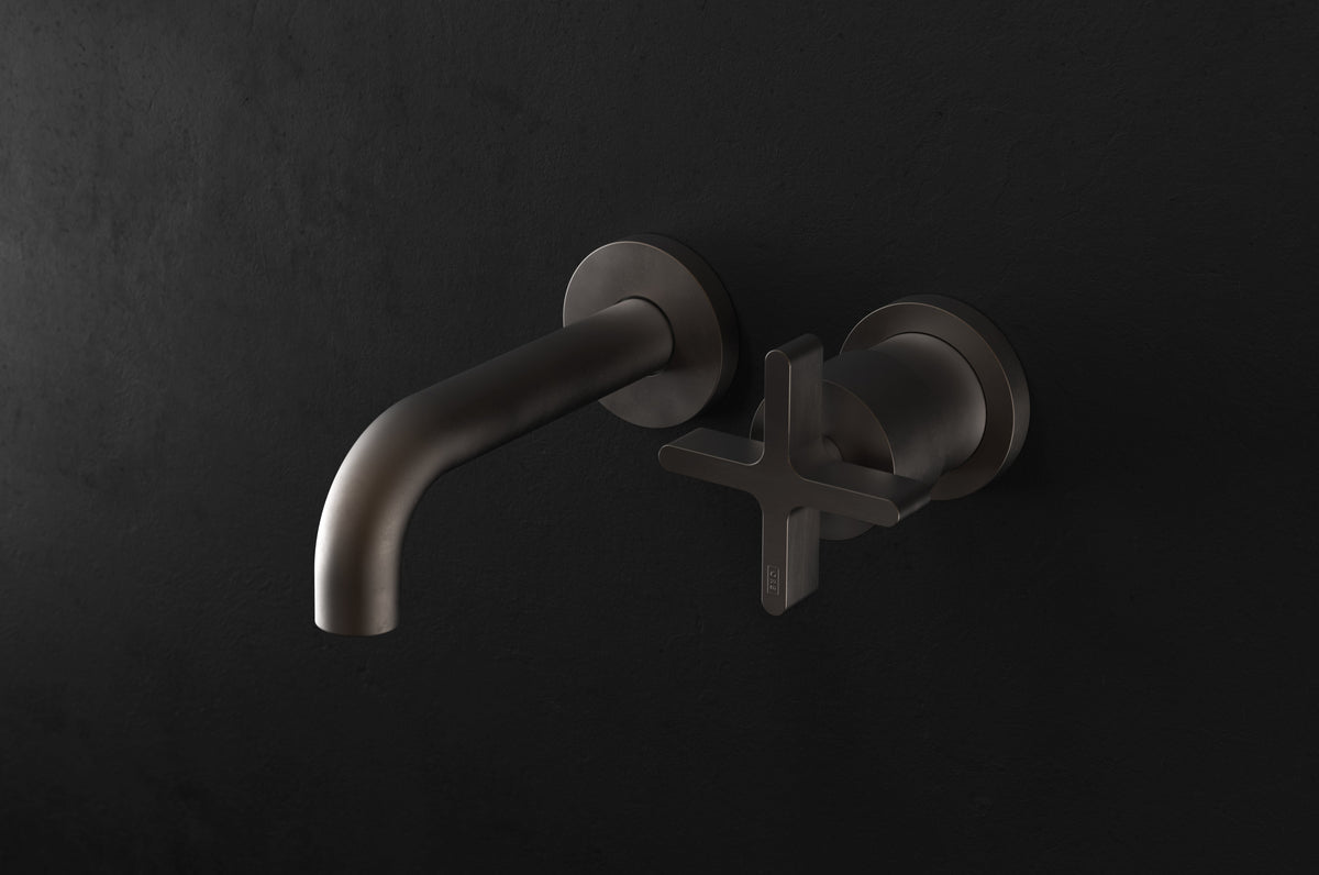 Studio Ore Chapter Three Two Hole Wall Mounted Basin Mixer with Angled Spout with Cross handle in bronze, short spout