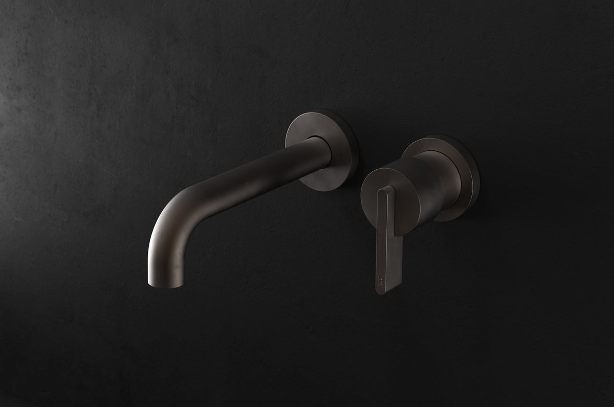 Studio Ore Chapter Three Two Hole Wall Mounted Basin Mixer with Angled Spout with Lever handle in bronze, long spout