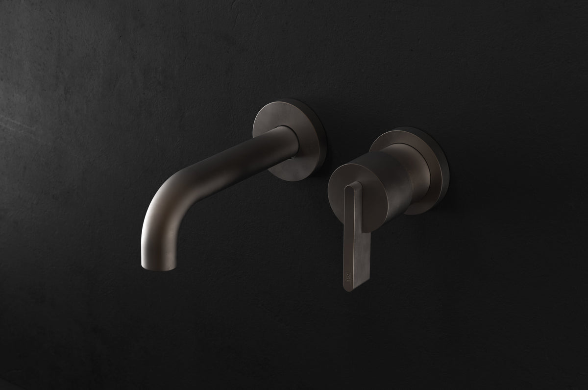 Studio Ore Chapter Three Two Hole Wall Mounted Basin Mixer with Angled Spout with Lever handle in bronze, short spout