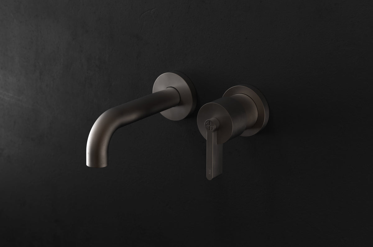 Studio Ore Chapter Three Two Hole Wall Mounted Basin Mixer with Angled Spout with Teardrop Lever handle in bronze, short spout
