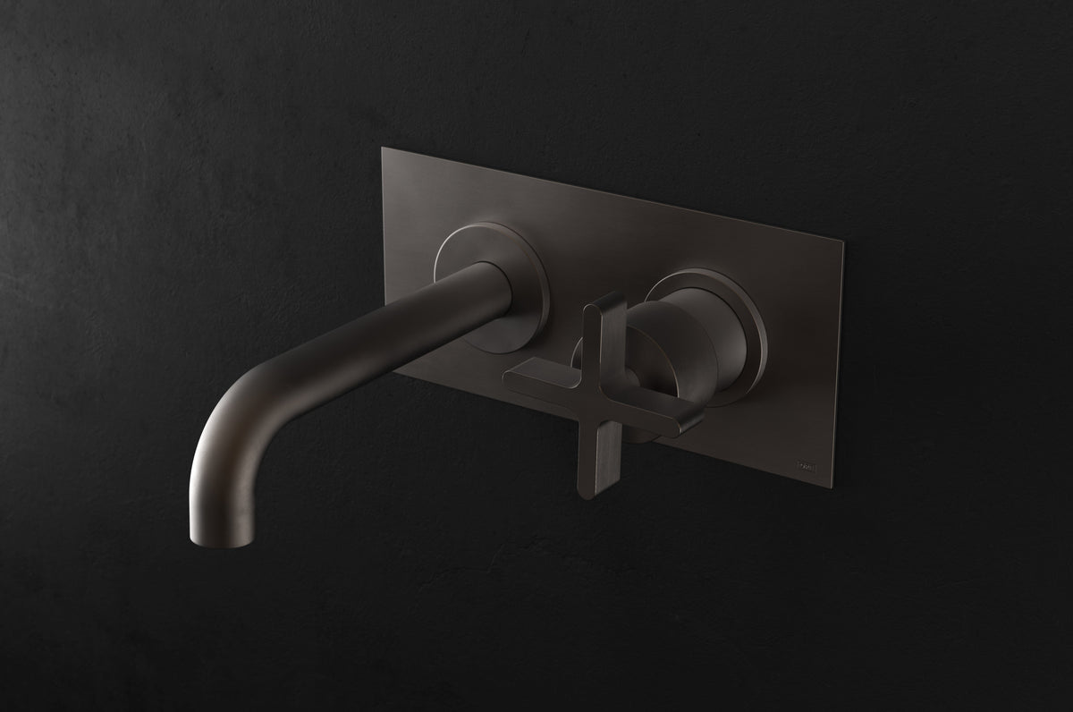 Studio Ore Chapter Three Two Hole Wall Mounted Basin Mixer with Angled Spout and Backplate with Cross handle in bronze, long spout