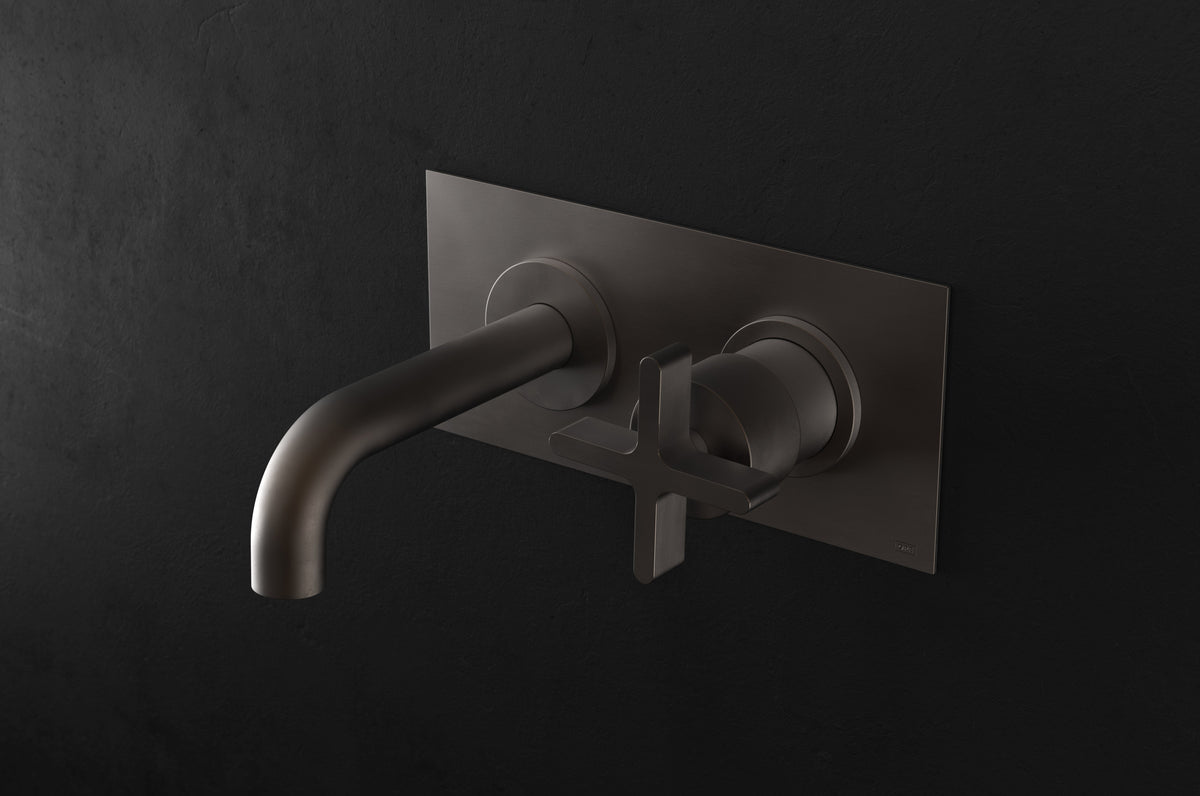 Studio Ore Chapter Three Two Hole Wall Mounted Basin Mixer with Angled Spout and Backplate with Cross handle in bronze, short spout